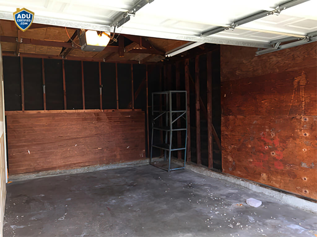 Finished garage conversion ADU interior with kitchen and laundry